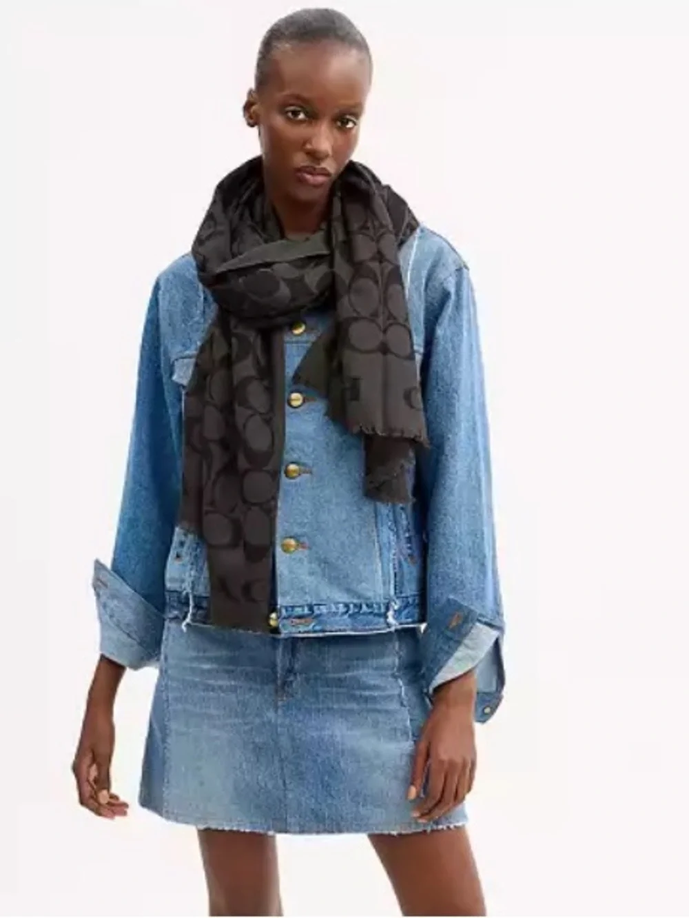 Coach Signature Wrap  made from a wool and silk blend with a tonal jacquard logo